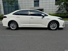 2021 Toyota Corolla Hybrid 1.8L E-CVT Elite, белый — фото 7