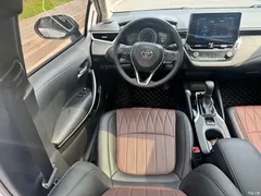 2021 Toyota Corolla Hybrid 1.8L E-CVT Elite, белый — фото 15