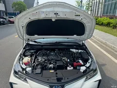 2021 Toyota Corolla Hybrid 1.8L E-CVT Elite, белый — фото 18