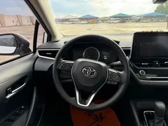 2021 Toyota Corolla 1.2T S-CVT Elite, белый — фото 10