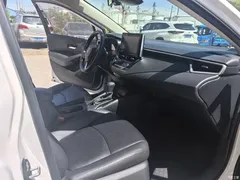 2021 Toyota Corolla 1.2T S-CVT Elite PLUS, белый — фото 10