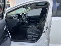 2021 Toyota Corolla Hybrid 1.8L E-CVT Elite, белый — фото 11