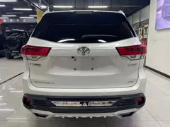 2021 Toyota Highlander 2.0T 4WD Elite 7-seat, белый — фото 5