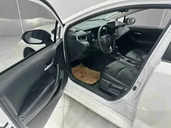 2021 Toyota Corolla 1.2T S-CVT Elite Plus, белый — фото 8