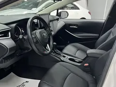 2021 Toyota Corolla Hybrid 1.8L E-CVT Elite, белый — фото 14