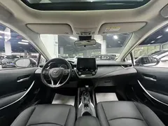 2021 Toyota Corolla Hybrid 1.8L E-CVT Elite, белый — фото 17