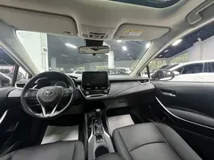 2021 Toyota Corolla Hybrid 1.8L E-CVT Elite, белый — фото 18