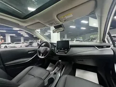 2021 Toyota Corolla Hybrid 1.8L E-CVT Elite, белый — фото 19