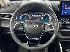 2022 Toyota Highlander Hybrid 2.5L 4WD Premium 7, белый — фото 19
