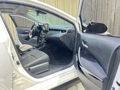 2021 Toyota Corolla Hybrid 1.8L E-CVT Elite, белый — фото 10