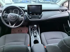 2021 Toyota Corolla Hybrid 1.8L E-CVT Elite, белый — фото 7