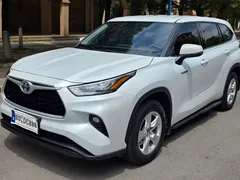 2022 Toyota Highlander Hybrid 2.5L 4WD Elite 7, белый — фото 1