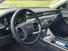 2023 Audi A8L 50 TFSI quattro Select, чёрный — фото 7