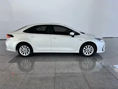 2021 Toyota Corolla Hybrid 1.8L E-CVT Elite, белый — фото 3