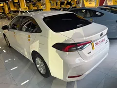 2021 Toyota Corolla 1.8L E-CVT, белый — фото 5