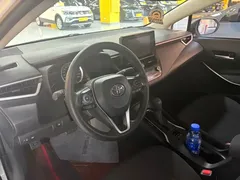 2021 Toyota Corolla 1.8L E-CVT, белый — фото 7