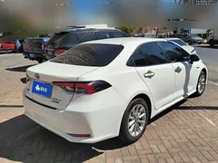 2021 Toyota Corolla Hybrid 1.8L E-CVT Elite, белый — фото 3