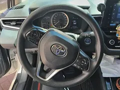 2021 Toyota Corolla Hybrid 1.8L E-CVT Elite, белый — фото 15