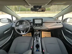 2021 Toyota Corolla 1.8L E-CVT, белый — фото 12