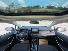 2021 Toyota Corolla 1.8L E-CVT, белый — фото 14