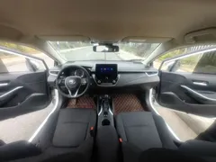 2022 Toyota Corolla 1.8L Hybrid E-CVT, белый — фото 12