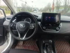 2022 Toyota Corolla 1.8L Hybrid E-CVT, белый — фото 15