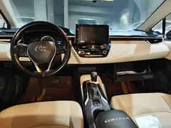 2019 Toyota Corolla 1.2T S-CVT GL-i Luxury, белый — фото 5