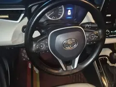 2019 Toyota Corolla 1.2T S-CVT GL-i Luxury, белый — фото 6