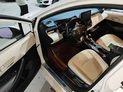 2019 Toyota Corolla 1.2T S-CVT GL-i Luxury, белый — фото 12