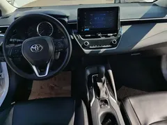 2021 Toyota Corolla 1.2T S-CVT Elite, белый — фото 12