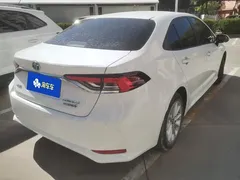 2021 Toyota Corolla Hybrid 1.8L E-CVT Elite, белый — фото 3
