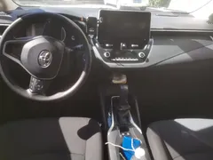 2021 Toyota Corolla Hybrid 1.8L E-CVT Elite, белый — фото 12