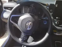 2021 Toyota Corolla Hybrid 1.8L E-CVT Elite, белый — фото 15