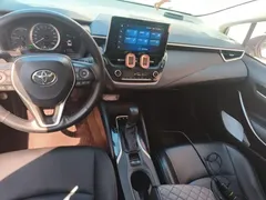 2021 Toyota Corolla Hybrid 1.8L E-CVT Elite, белый — фото 5