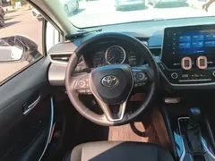 2021 Toyota Corolla Hybrid 1.8L E-CVT Elite, белый — фото 6