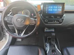 2021 Toyota Corolla TNGA 1.5L CVT Elite, белый — фото 5