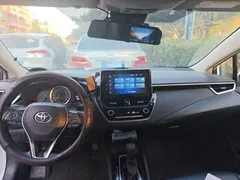 2021 Toyota Corolla TNGA 1.5L CVT Elite, белый — фото 14