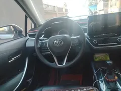 2021 Toyota Corolla Hybrid 1.8L E-CVT Elite, белый — фото 6