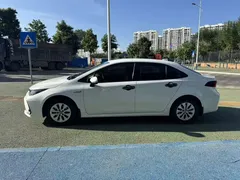 2021 Toyota Corolla Hybrid 1.8L E-CVT Elite, белый — фото 7