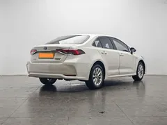 2021 Toyota Corolla Hybrid 1.8L E-CVT Elite, белый — фото 3
