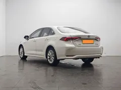 2021 Toyota Corolla Hybrid 1.8L E-CVT Elite, белый — фото 4