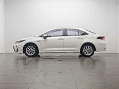 2021 Toyota Corolla Hybrid 1.8L E-CVT Elite, белый — фото 10