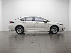2021 Toyota Corolla Hybrid 1.8L E-CVT Elite, белый — фото 11