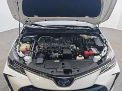 2021 Toyota Corolla Hybrid 1.8L E-CVT Elite, белый — фото 13