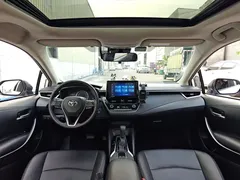 2021 Toyota Corolla Hybrid 1.8L E-CVT Elite, белый — фото 13