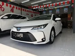 2021 Toyota Corolla Hybrid 1.8L E-CVT Elite, белый — фото 1