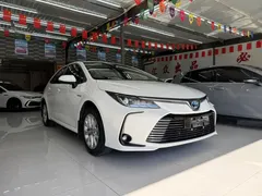 2021 Toyota Corolla Hybrid 1.8L E-CVT Elite, белый — фото 2
