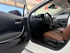 2021 Toyota Corolla Hybrid 1.8L E-CVT Elite, белый — фото 7