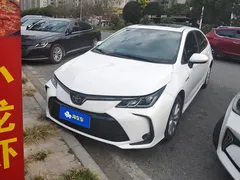 2021 Toyota Corolla Hybrid 1.8L E-CVT Elite, белый — фото 2