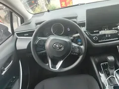 2021 Toyota Corolla Hybrid 1.8L E-CVT Elite, белый — фото 15